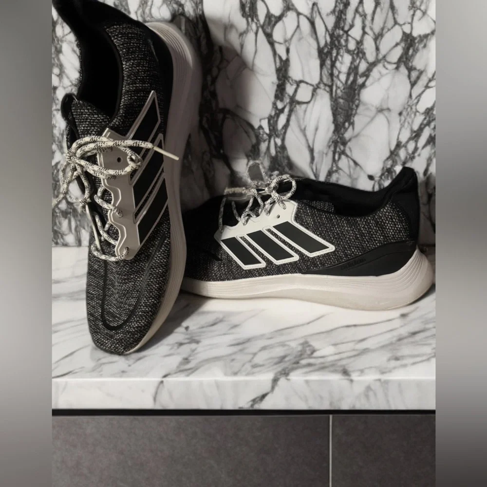 Adidas Black and White Sneakers with Sleek Design